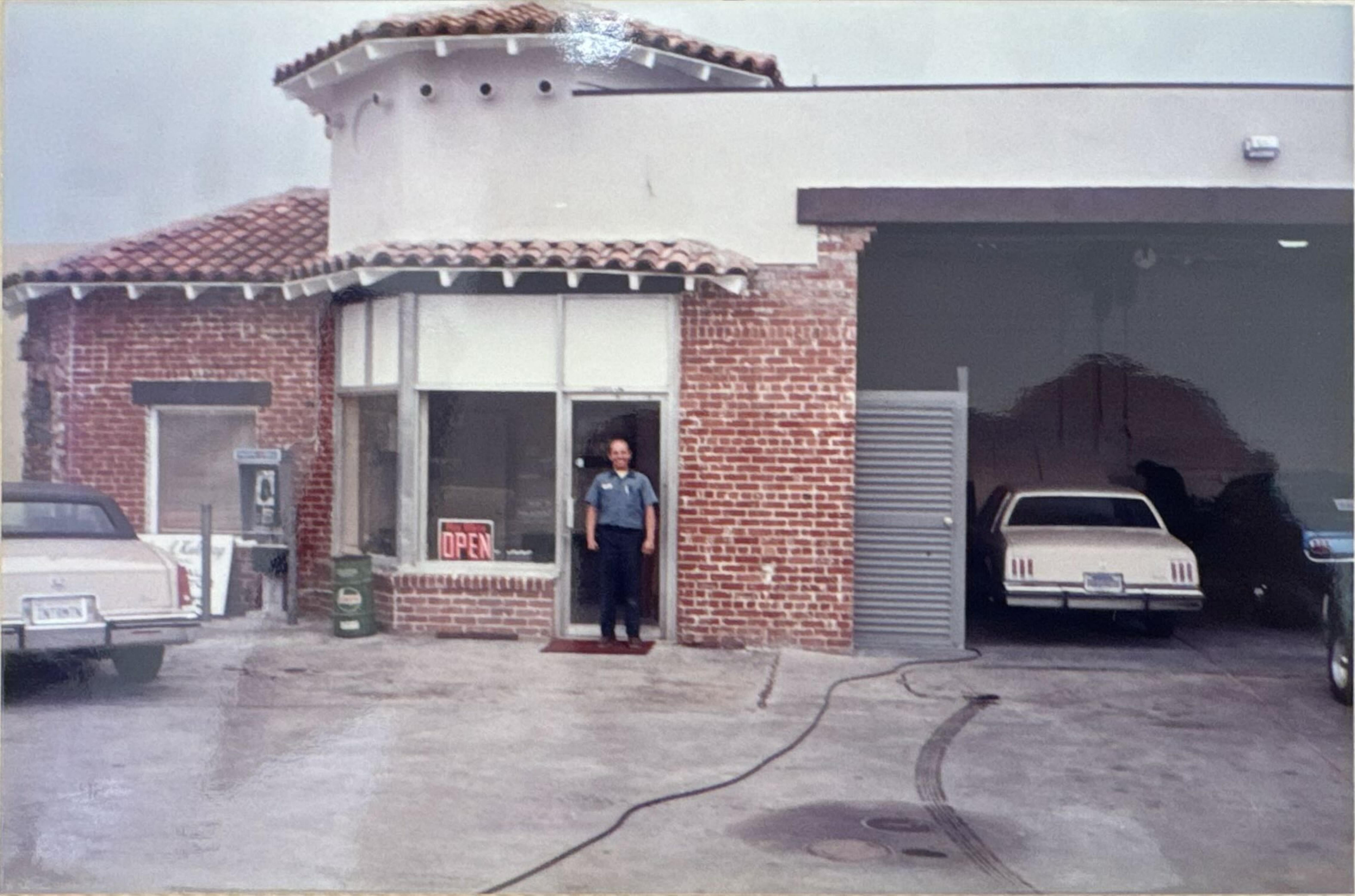 Bob Reed standing in the doorway of the service station